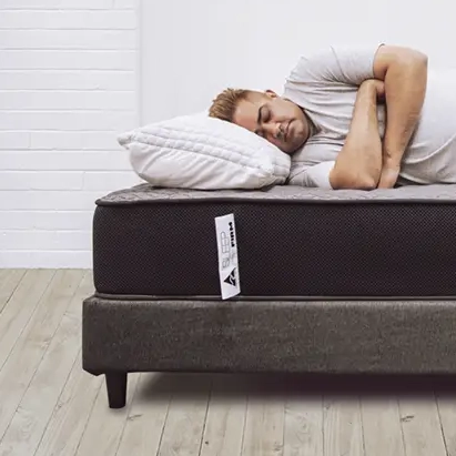 Man-sleeping-on-a-Sleep-Firm-Mattress2-Sleep Firm